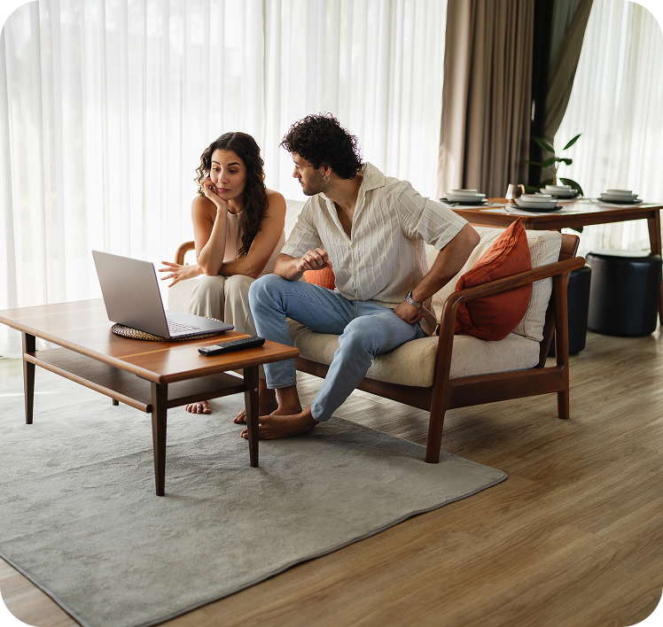 Relaxed couple using a laptop together