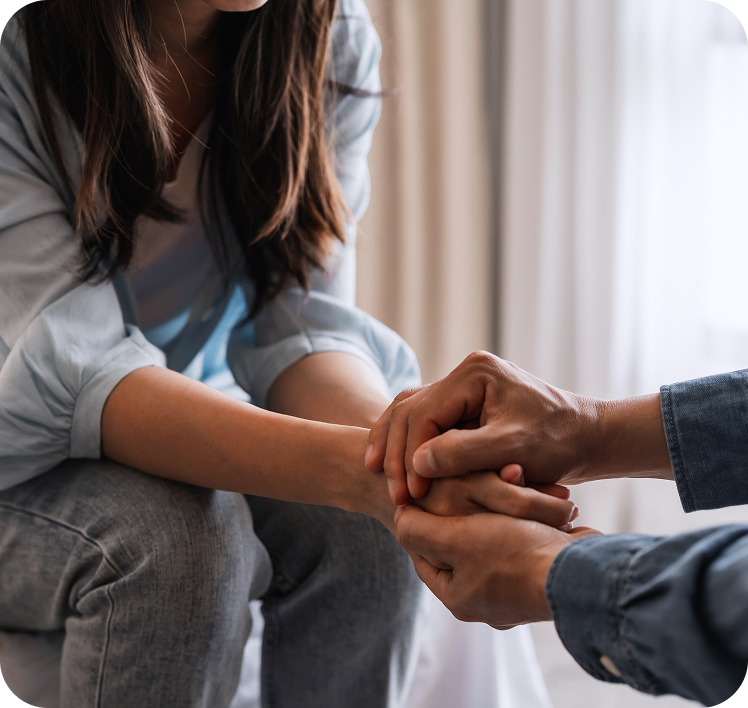 Comforting handhold between two individuals